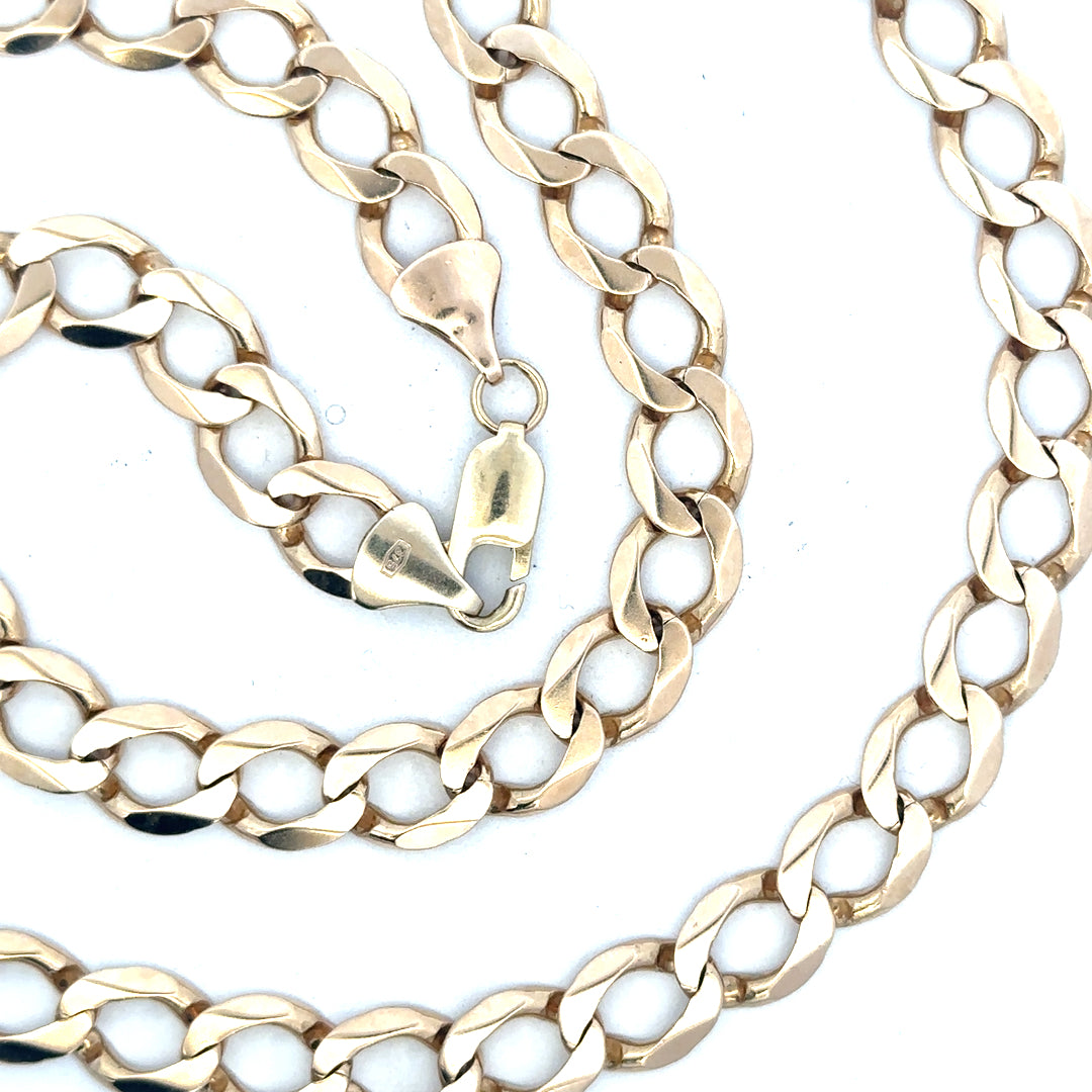9ct yellow gold curb chain with a sturdy design, weighing 53.9g, showcasing a classic jewelry piece with a polished finish.