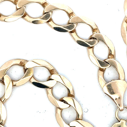 9ct yellow gold curb chain weighing 53.9g, featuring classic interlinked design, unbranded jewelry accessory.