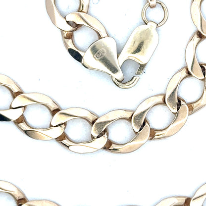 9ct yellow gold curb chain weighing 53.9g, unbranded jewelry piece with detailed links and polished finish.