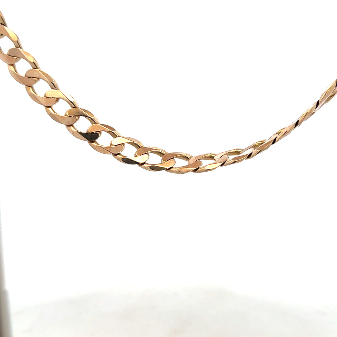 9ct yellow gold curb chain weighing 61.2g, unbranded jewelry with a classic design and polished finish.