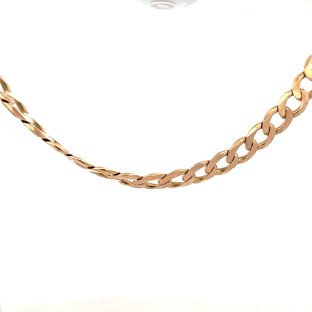 9ct yellow gold curb chain weighing 61.2g, featuring a classic design and polished finish.