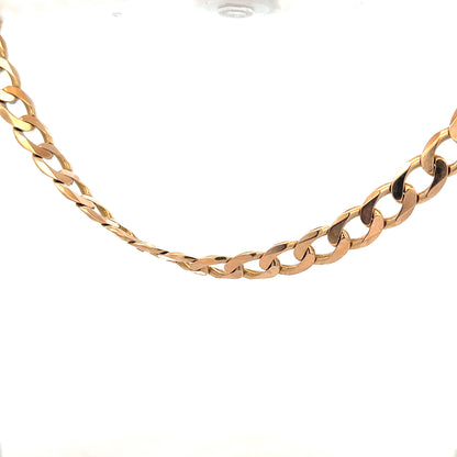 9ct yellow gold curb chain weighing 61.2g, with a classic linked design and secure clasp, unbranded jewelry accessory.