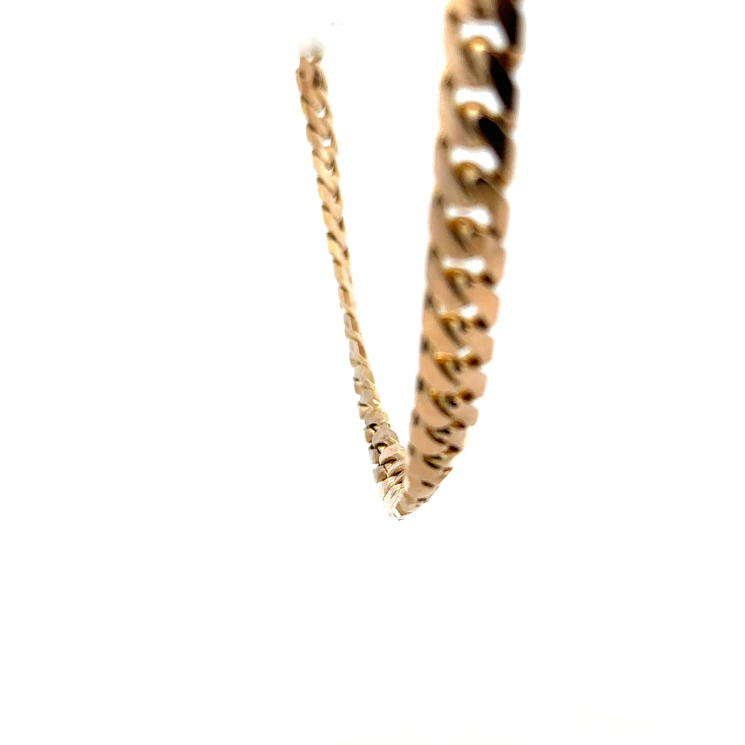 9ct yellow gold curb chain weighing 61.4g, unbranded jewelry with a classic link design.
