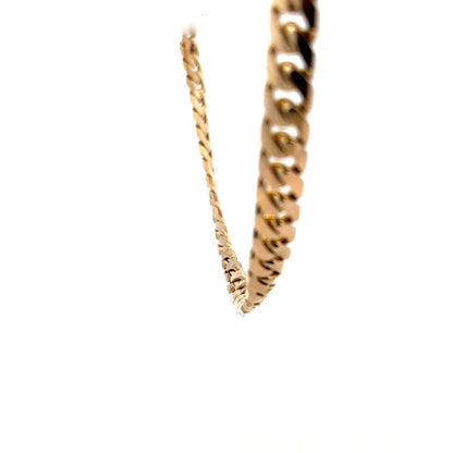9ct yellow gold curb chain weighing 61.4g, unbranded jewelry with a classic link design.