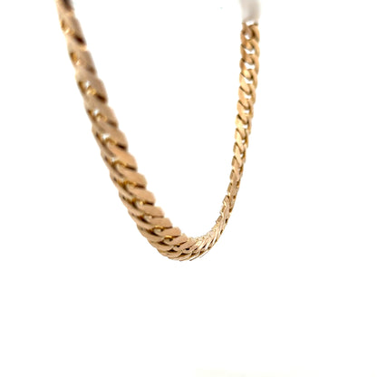 9ct yellow gold curb chain, unbranded, weighing 61.4g, with a detailed close-up of the classic chain links.