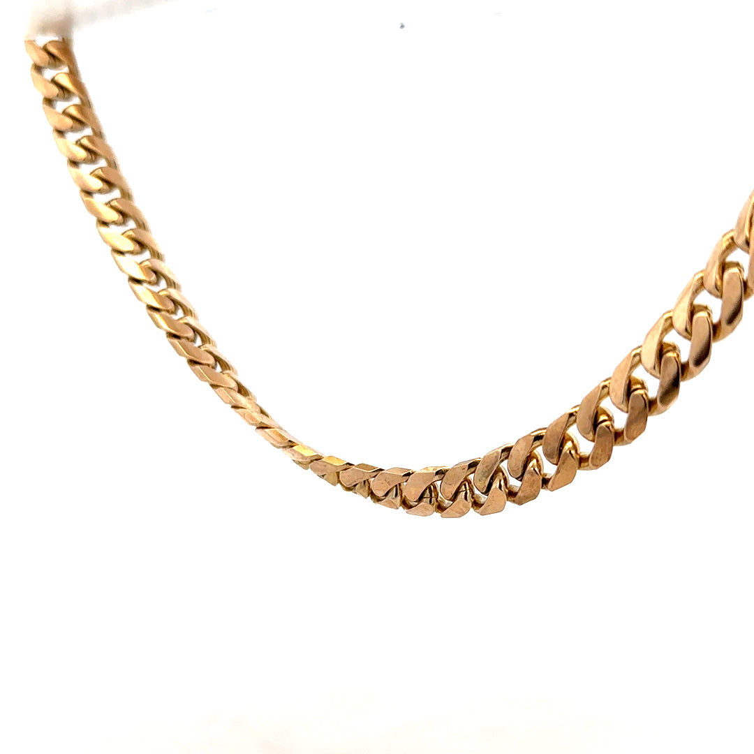 9ct yellow gold curb chain weighing 61.4g, featuring classic linked design and a polished finish.