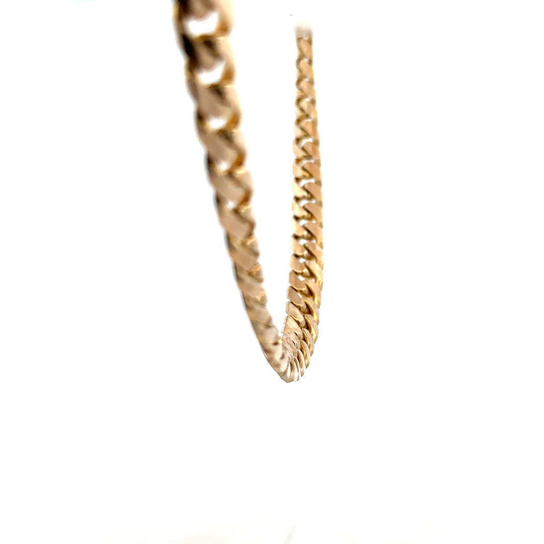 9ct yellow gold curb chain weighing 61.4g, unbranded jewelry with a classic linked design and polished finish.