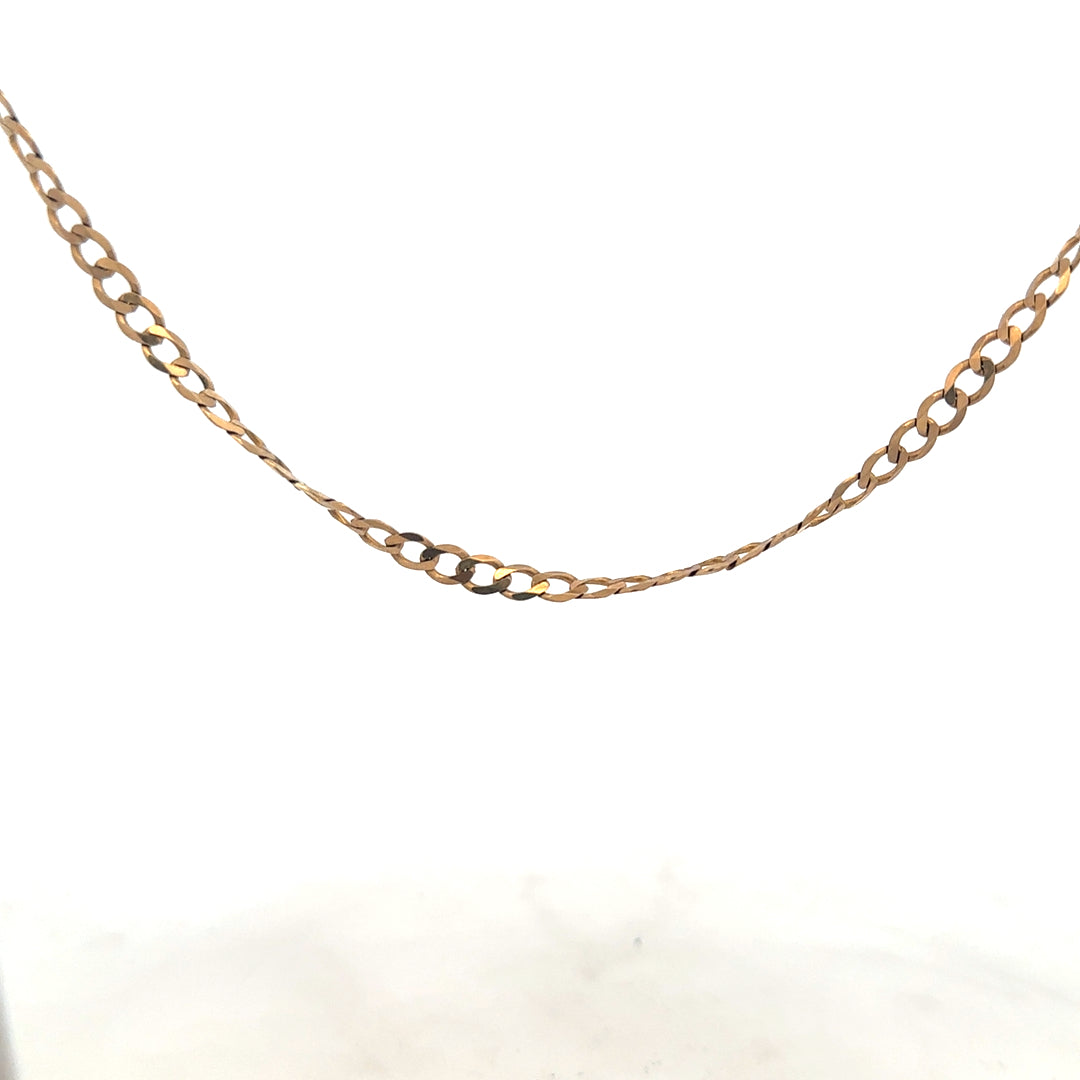 9ct yellow gold curb chain weighing 8.5g, unbranded jewelry with a classic linked design.