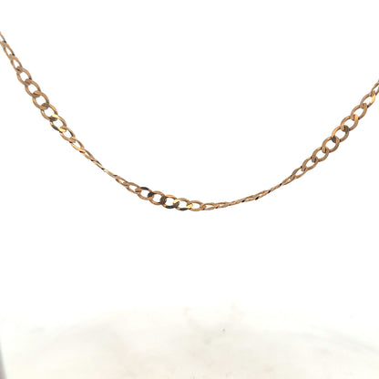9ct yellow gold curb chain weighing 8.5g, unbranded jewelry with a classic linked design.