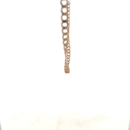 9ct yellow gold curb chain weighing 8.5g, showcasing a sleek, polished design with interlinked oval links.