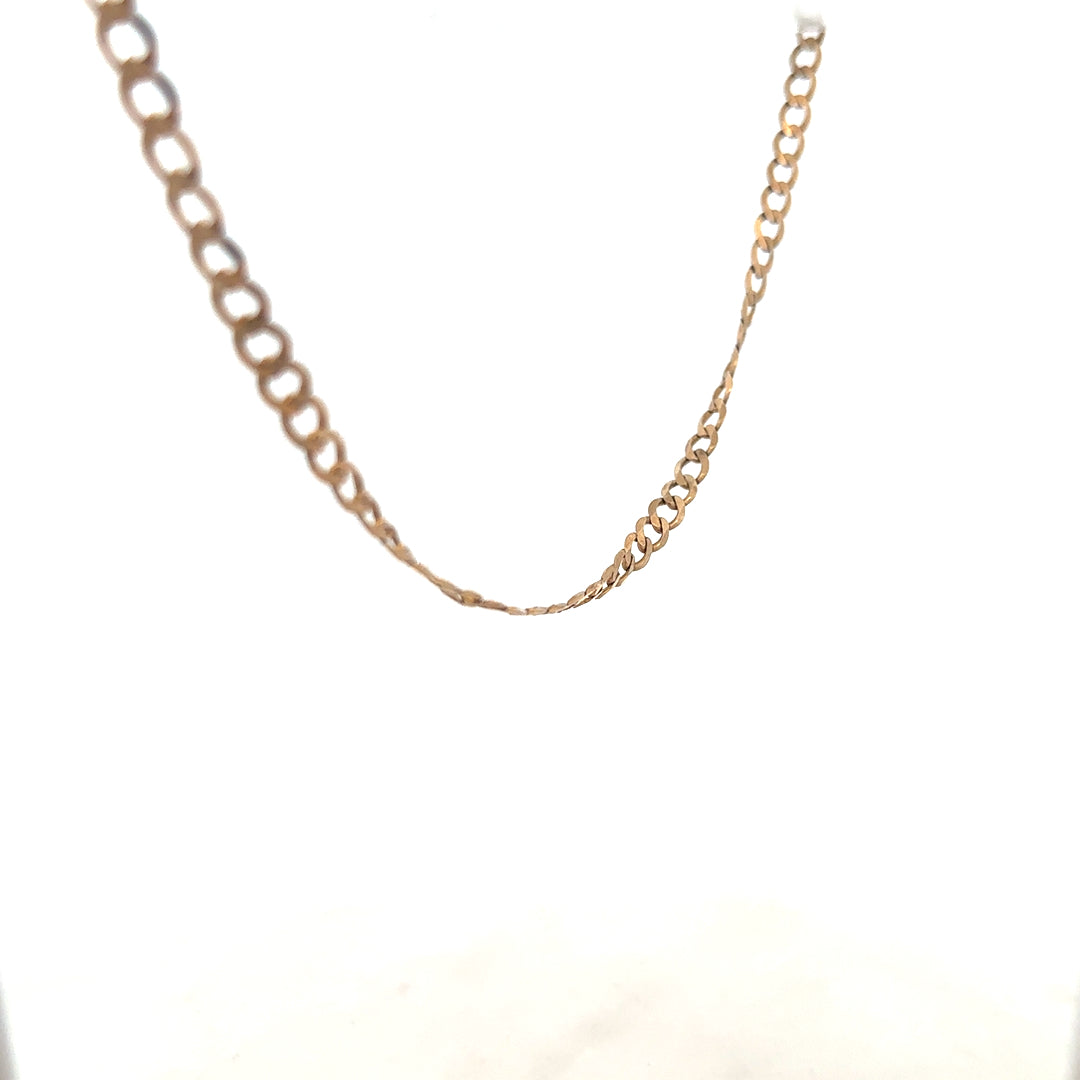 9ct yellow gold curb chain weighing 8.5g, featuring classic interlocking links, unbranded jewelry accessory.