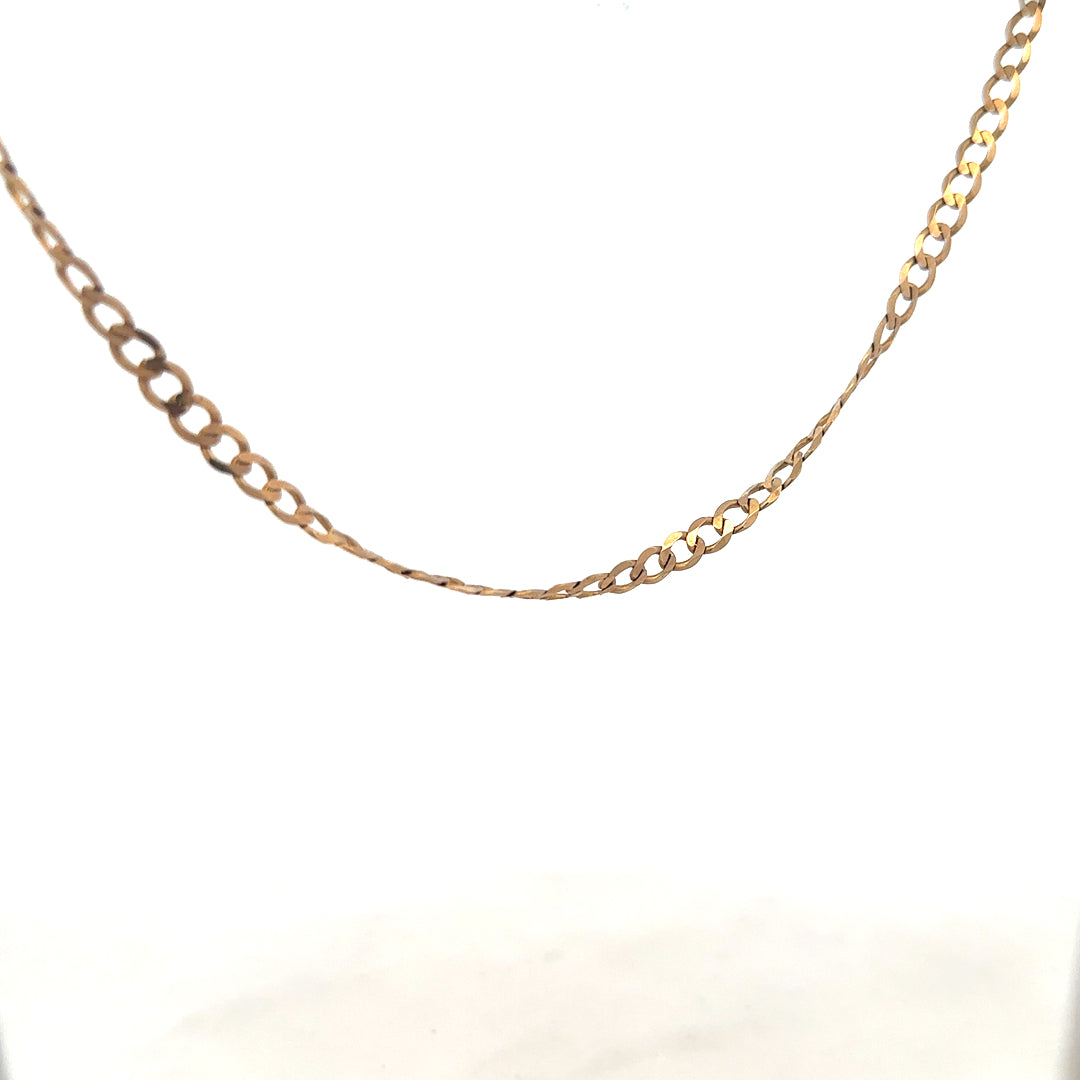 9ct yellow gold curb chain weighing 8.5g, displayed close-up with detailed links showcasing its craftsmanship and shine.