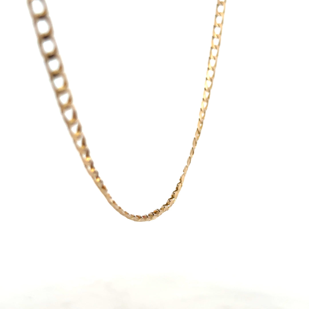 9ct yellow gold curb chain weighing 9.9g, featuring a classic link design, displayed on a plain background.