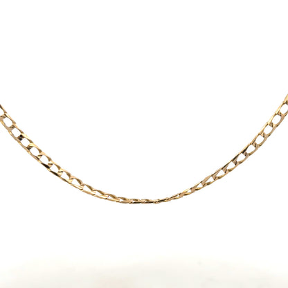 9ct yellow gold curb chain weighing 9.9g, featuring classic interlocking links, unbranded jewelry accessory.