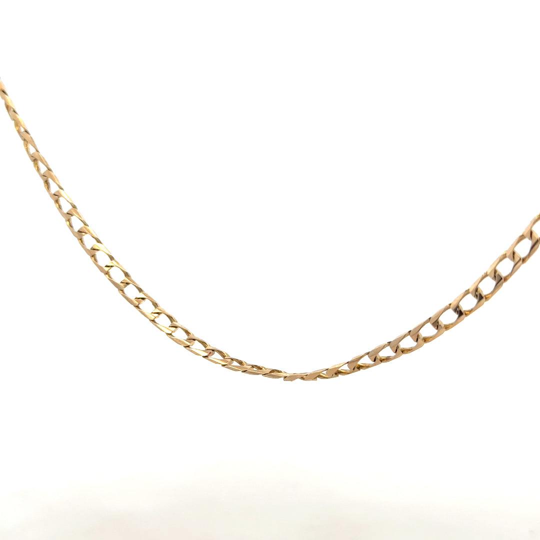 9ct yellow gold curb chain weighing 9.9g, featuring classic links and a polished finish, ideal for everyday wear.