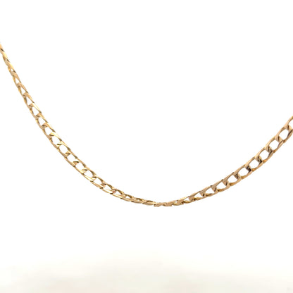 9ct yellow gold curb chain weighing 9.9g, featuring classic links and a polished finish, ideal for everyday wear.