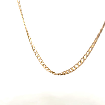 9ct yellow gold curb chain weighing 9.9g, featuring classic linked design, unbranded jewelry accessory.