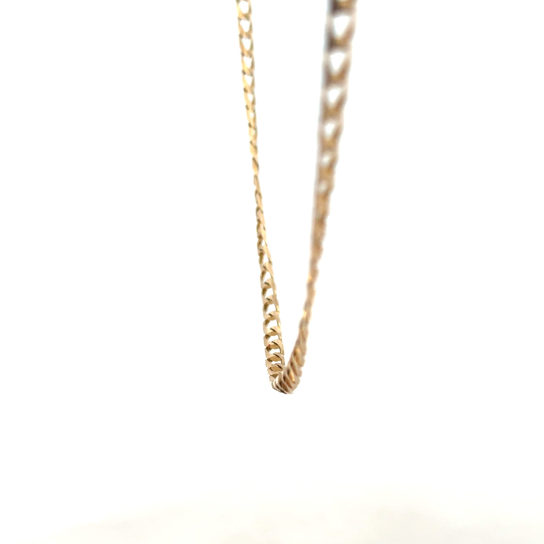 9ct yellow gold curb chain weighing 9.9g, showcasing a classic design with polished links, unbranded jewelry accessory.