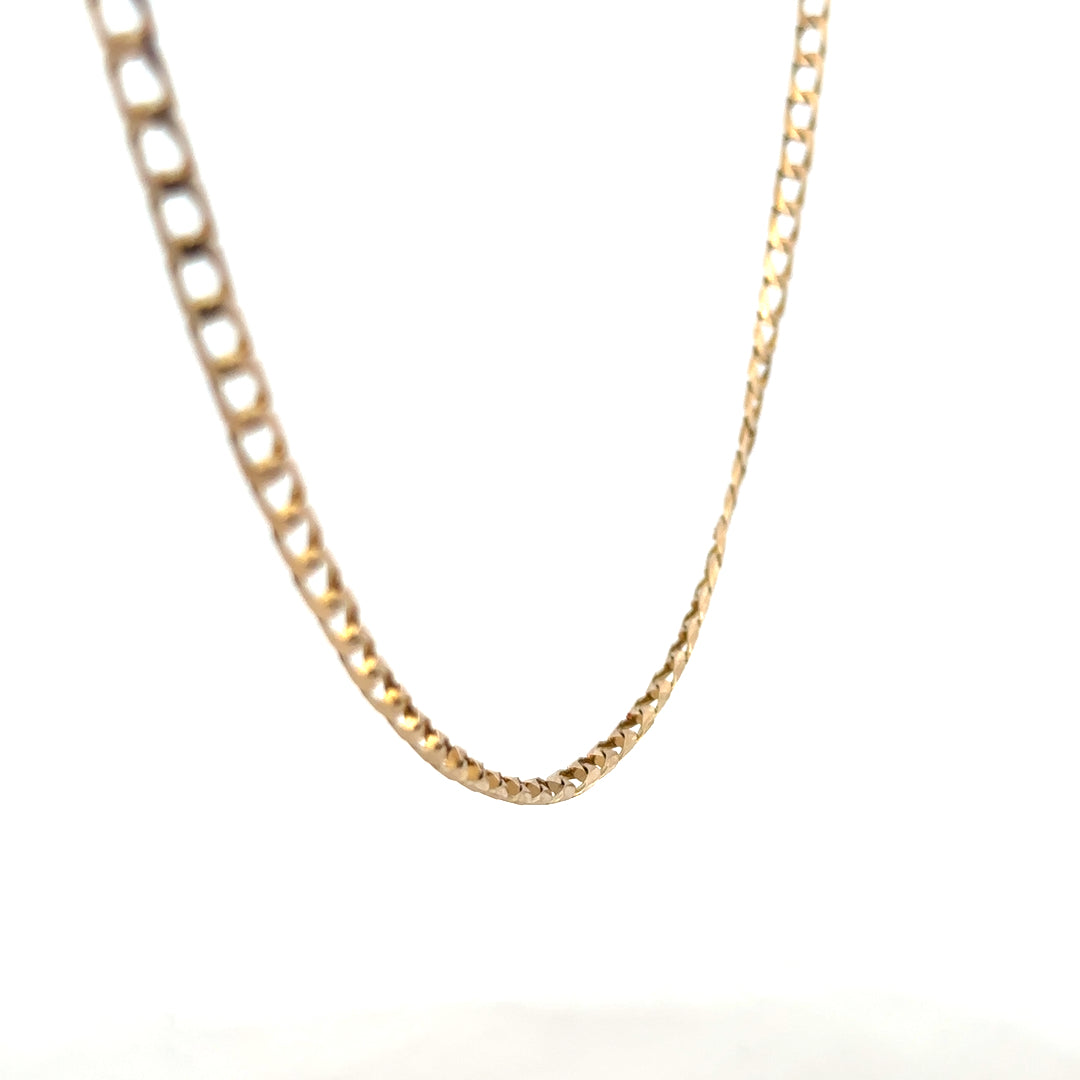 9ct yellow gold curb chain weighing 9.9g, featuring a classic linked design, unbranded jewelry accessory.