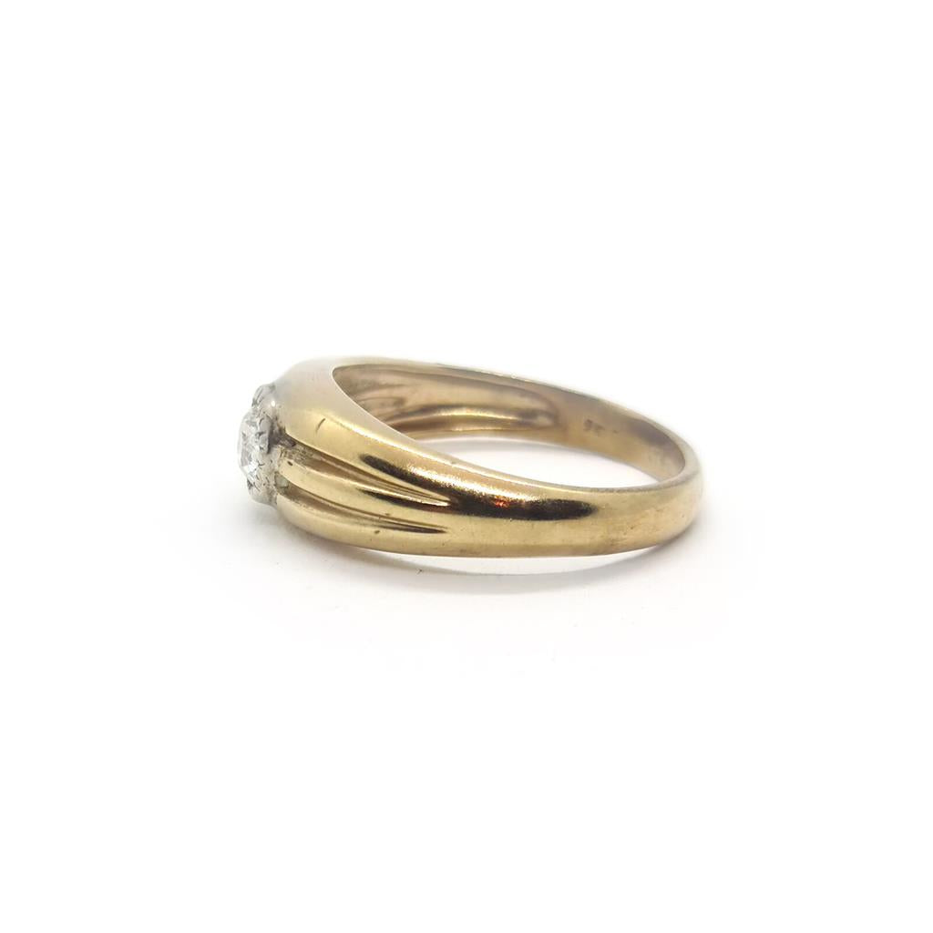 9ct yellow gold diamond ring featuring a sparkling central diamond and a sleek gold band, unbranded jewelry piece.