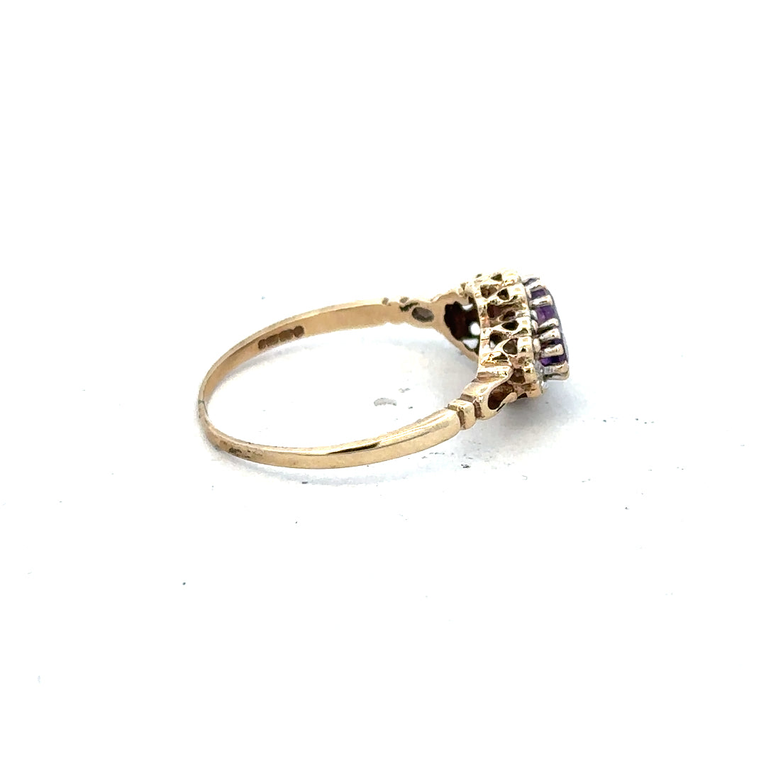 9ct yellow gold ring with diamond and amethyst gemstones, size Q, featuring a stylish and elegant design.