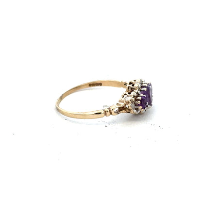 9ct yellow gold ring with diamond and amethyst gemstones, size Q, featuring a detailed band design.
