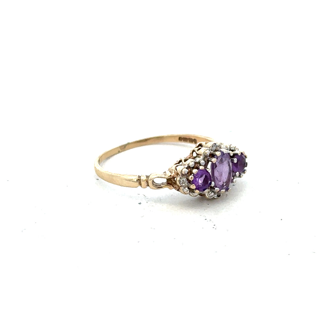 9ct yellow gold ring with diamond and amethyst gemstones, size Q, featuring an elegant and colorful design.