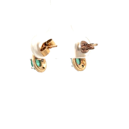 9ct yellow gold earrings with diamonds and emeralds, featuring a delicate design and sparkling gemstones.