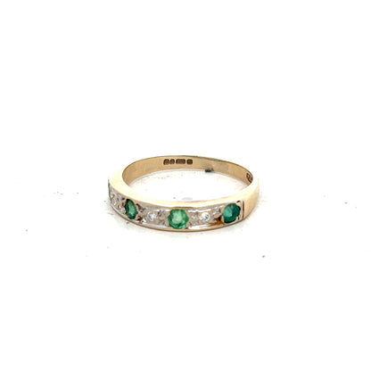 9ct yellow gold ring with diamond and emerald accents, size K, featuring a detailed gemstone design.