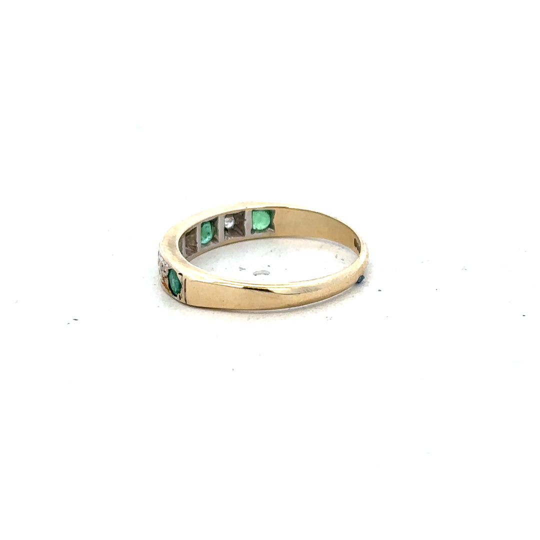 9ct yellow gold ring with diamonds and emeralds, size K, featuring intricate gemstone detailing and a polished gold band.