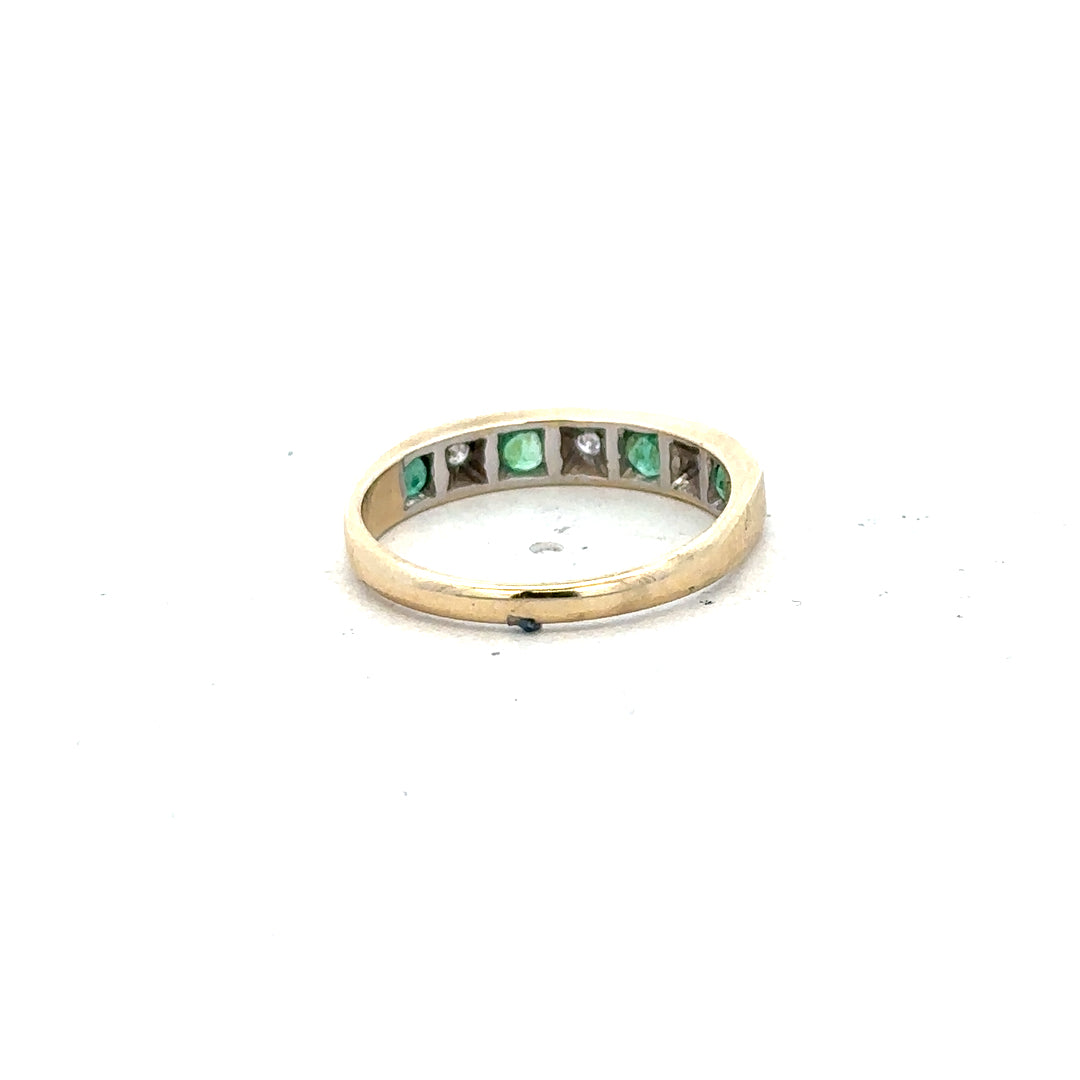 9ct yellow gold ring with diamond and emerald accents, size K, showcasing detailed craftsmanship and sparkling gemstone design.