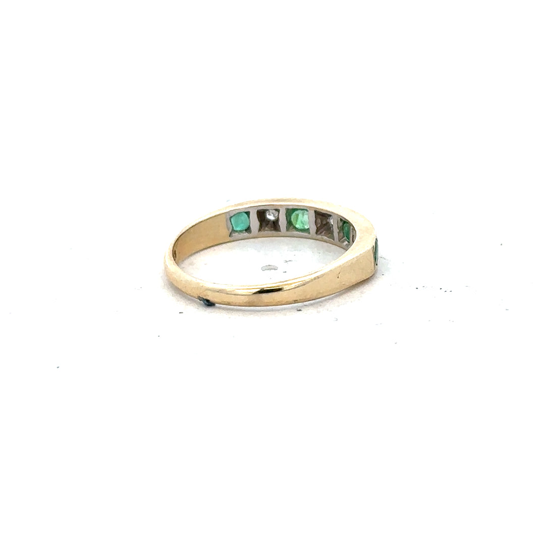 9ct yellow gold ring with diamonds and emeralds, size K, featuring intricate gemstone detailing and a polished gold band.