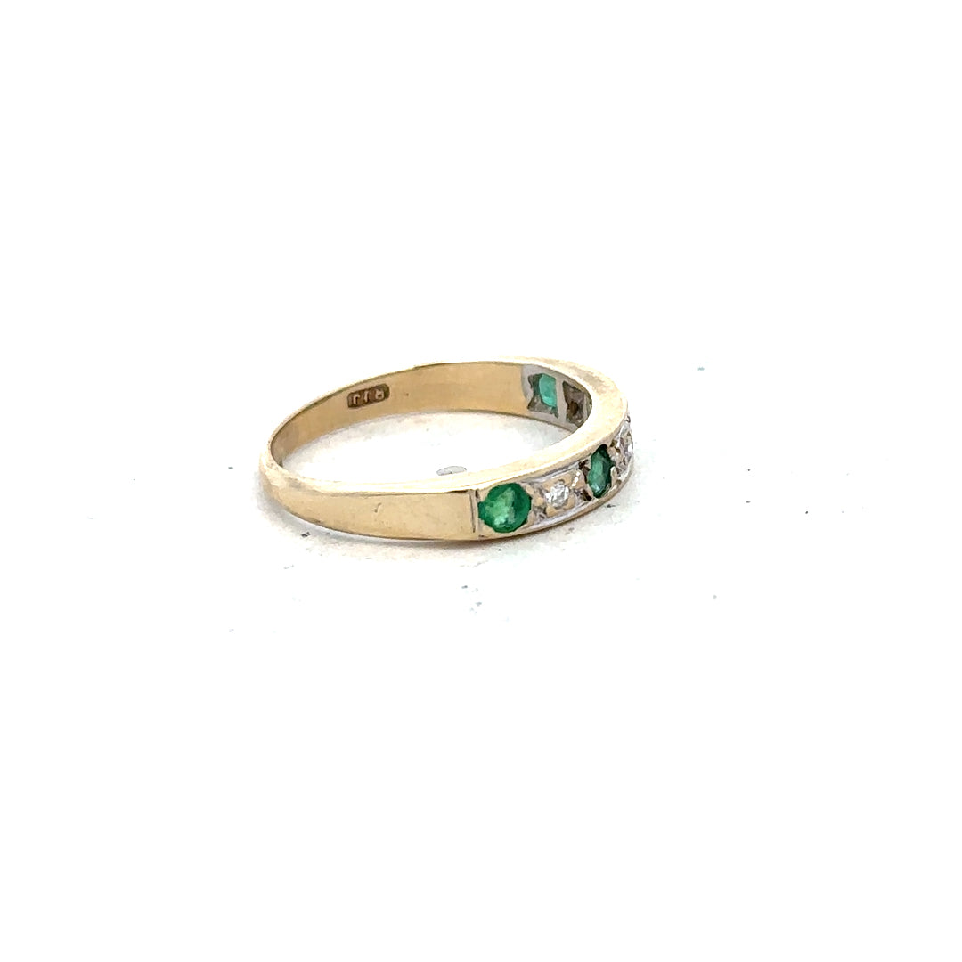 9ct yellow gold diamond and emerald ring in size K, featuring a detailed design with sparkling gemstones on a polished band.