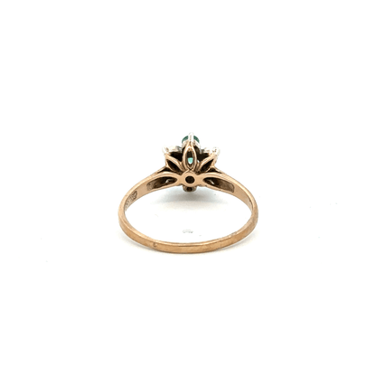 9ct yellow gold ring with diamonds and emeralds, size O, featuring intricate gemstone details and a polished gold band.