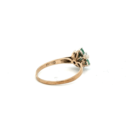 9ct yellow gold diamond and emerald ring, size O, featuring a central diamond and emerald accents.