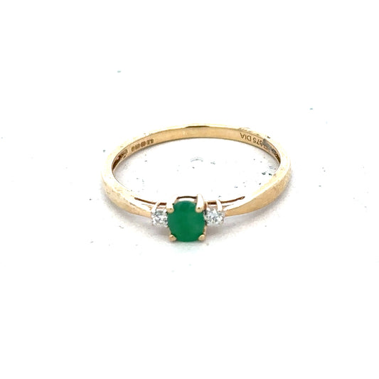 9ct yellow gold diamond and emerald ring size S, featuring a central emerald with diamond accents, shown on a white background.