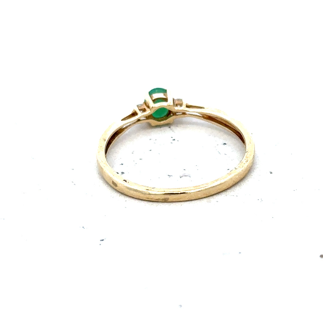 9ct yellow gold diamond and emerald ring in size S, featuring a vibrant emerald centerpiece with sparkling diamonds.