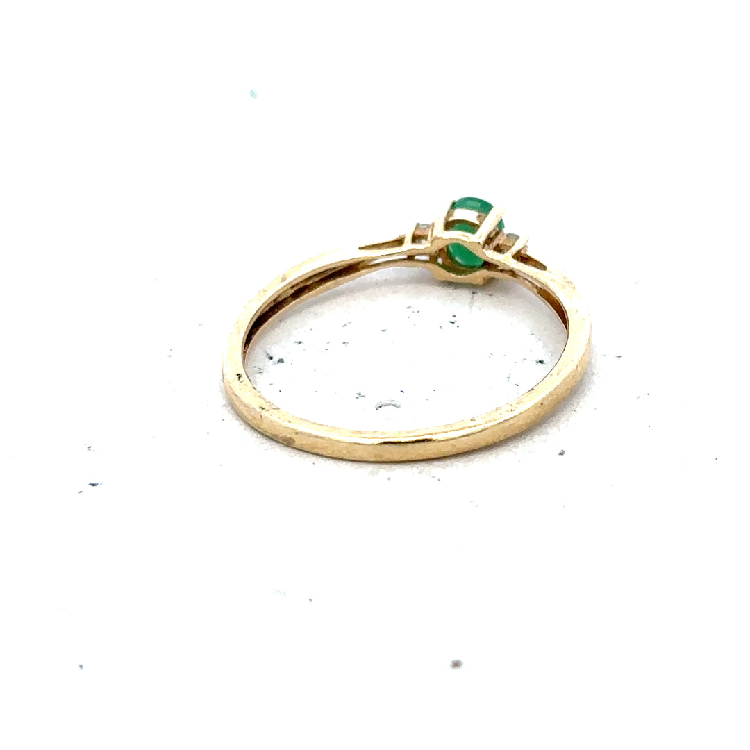 9ct yellow gold diamond and emerald ring in size S, featuring a detailed design with sparkling gemstones.