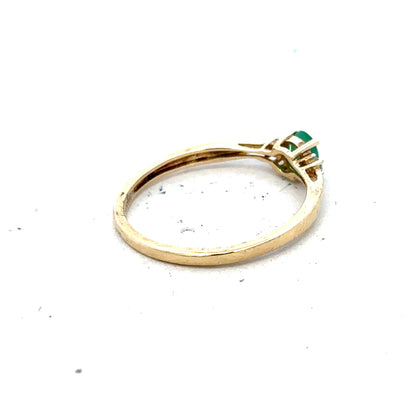 9ct yellow gold diamond and emerald ring in size S, featuring sparkling gemstones and a classic design.