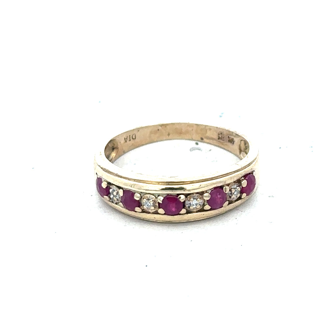 9ct yellow gold diamond and ruby ring, size M, 2.3g, featuring a sparkling diamond and vibrant ruby accents.