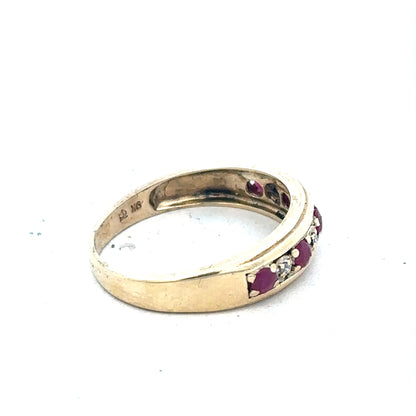 9ct yellow gold ring with diamonds and rubies, size M, featuring a detailed gemstone design and 2.3g weight.