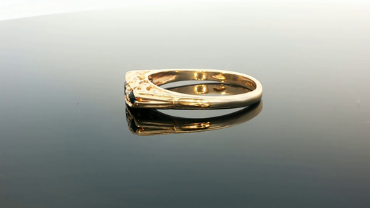 9ct yellow gold ring with diamonds and sapphires, featuring a detailed design and a polished finish.