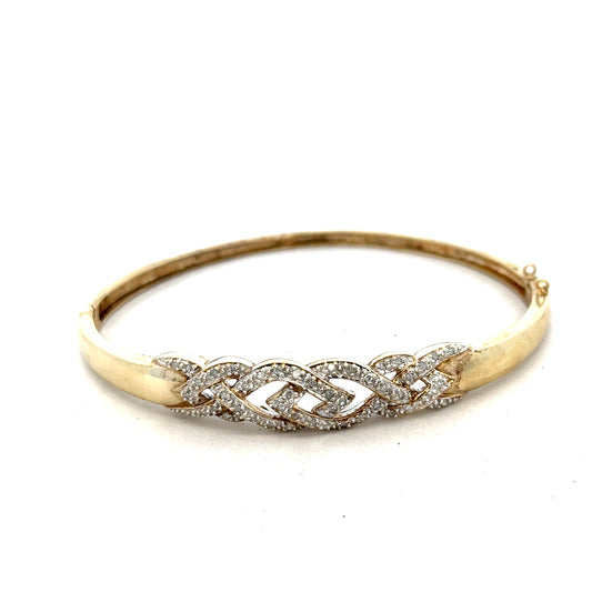 9ct yellow gold diamond bangle with intricate design, weighs 10 grams, showcasing sparkling diamonds on a high-quality jewelry piece.