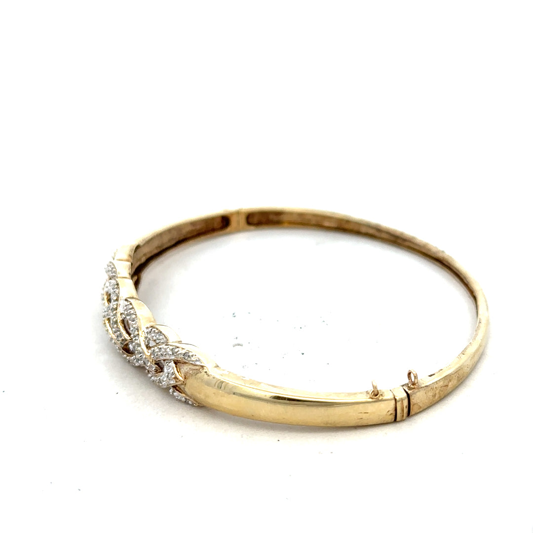 9ct yellow gold diamond bangle with sparkling diamonds, sleek design, and lightweight 10g weight. Elegant jewelry accessory.