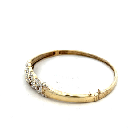 9ct yellow gold diamond bangle with sparkling diamonds, sleek design, and lightweight 10g weight. Elegant jewelry accessory.