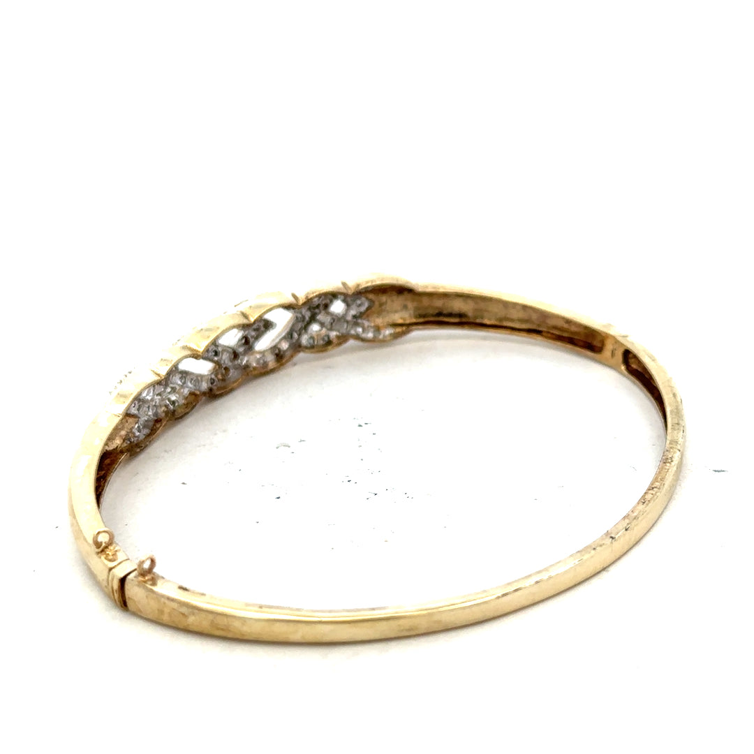 9ct yellow gold diamond bangle with delicate design, weighs 10g, crafted for elegant jewelry styling.