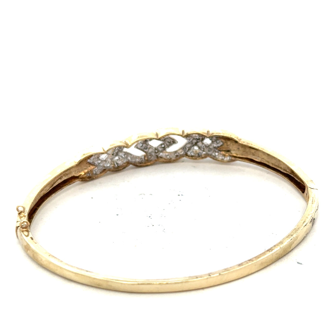 9ct yellow gold diamond bangle with intricate design, weighing 10g, showcasing sparkling diamonds on a stylish unbranded jewelry piece.