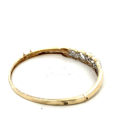 9ct yellow gold diamond bangle with intricate design, weighing 10g, featuring sparkling diamonds on a stylish unbranded jewelry piece.