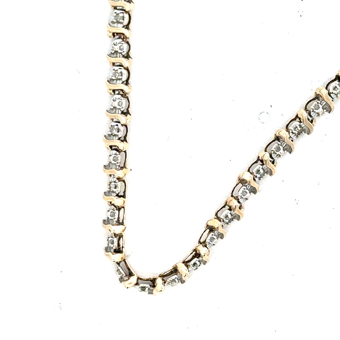 9ct yellow gold diamond bracelet weighing 5g, featuring sparkling diamonds and a sleek, elegant design.