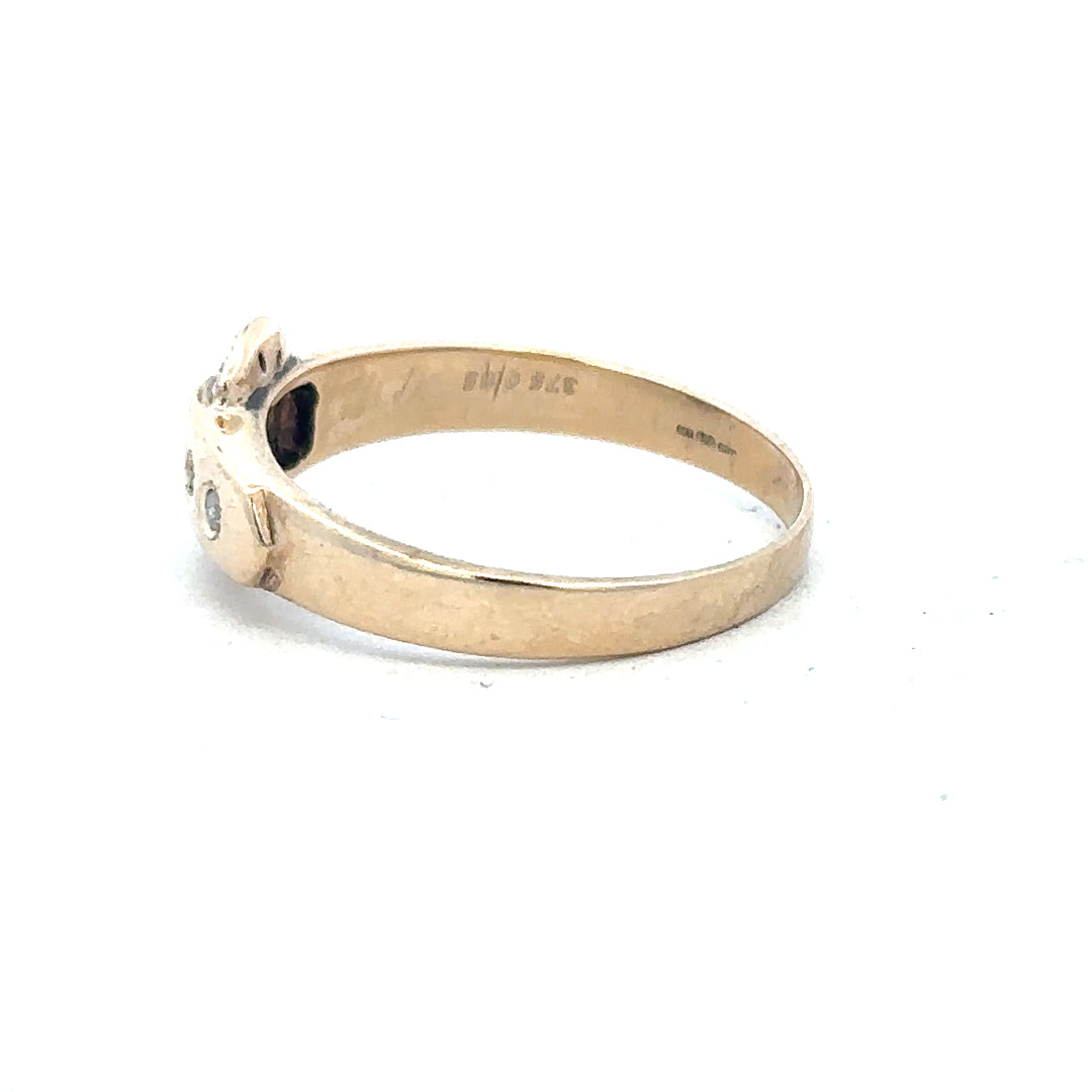 9ct yellow gold diamond buckle ring, size R, featuring a sparkling diamond accent and a sleek elegant design.